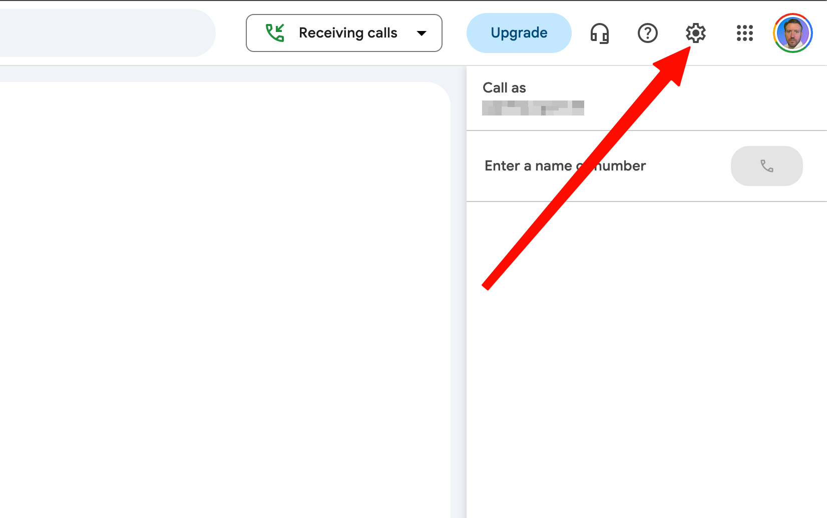 Google Voice web interface with a red arrow pointing to the Settings gear icon in the top right